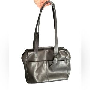 Rolf’s black leather bag